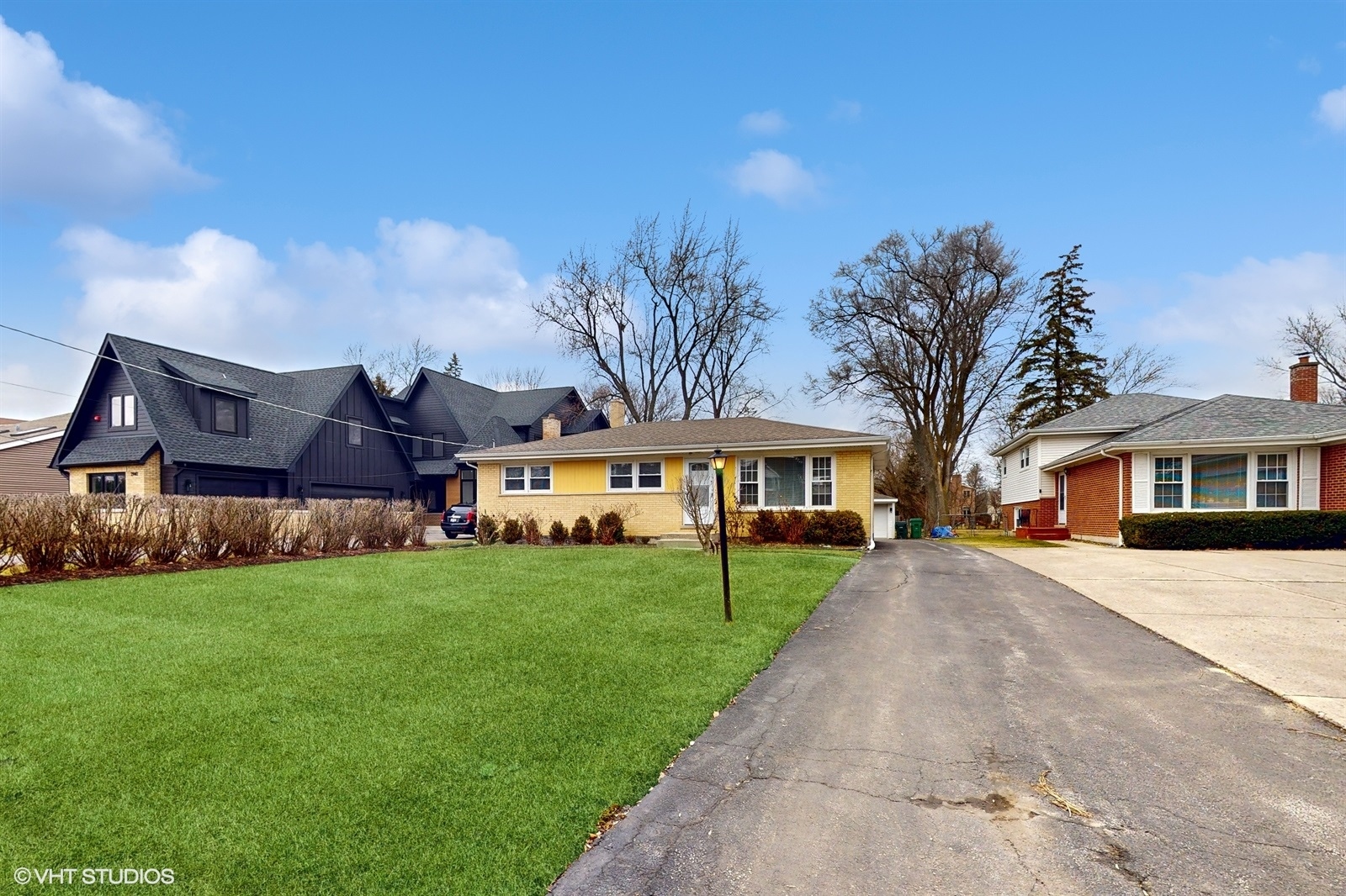 2930 Koepke Road Northbrook, IL 60062 - Photo 3 of 30 a front view of a house with a garden and trees