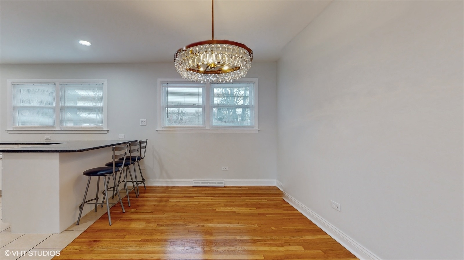 2930 Koepke Road Northbrook, IL 60062 - Photo 7 of 30 an empty room with wooden floor fan and windows