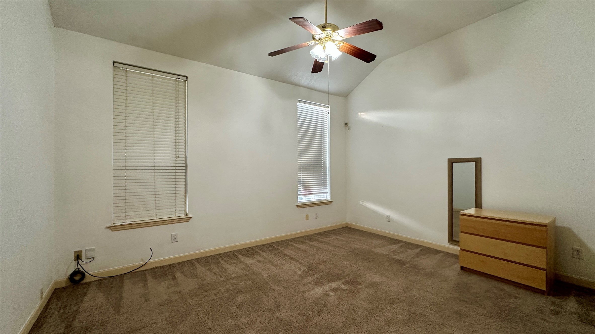 6918 Springcrest Court Sugar Land, TX 77479 - Photo 11 of 29 an empty room with windows and fan