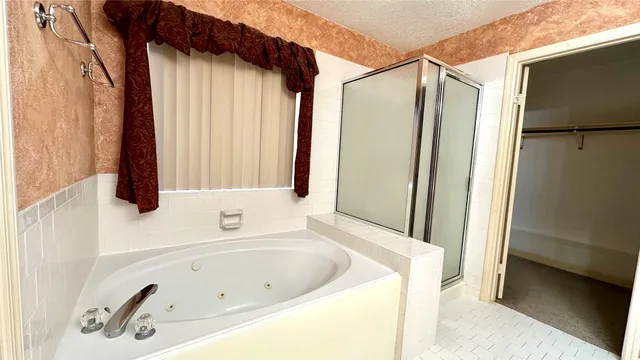a bathroom with a tub and a sink