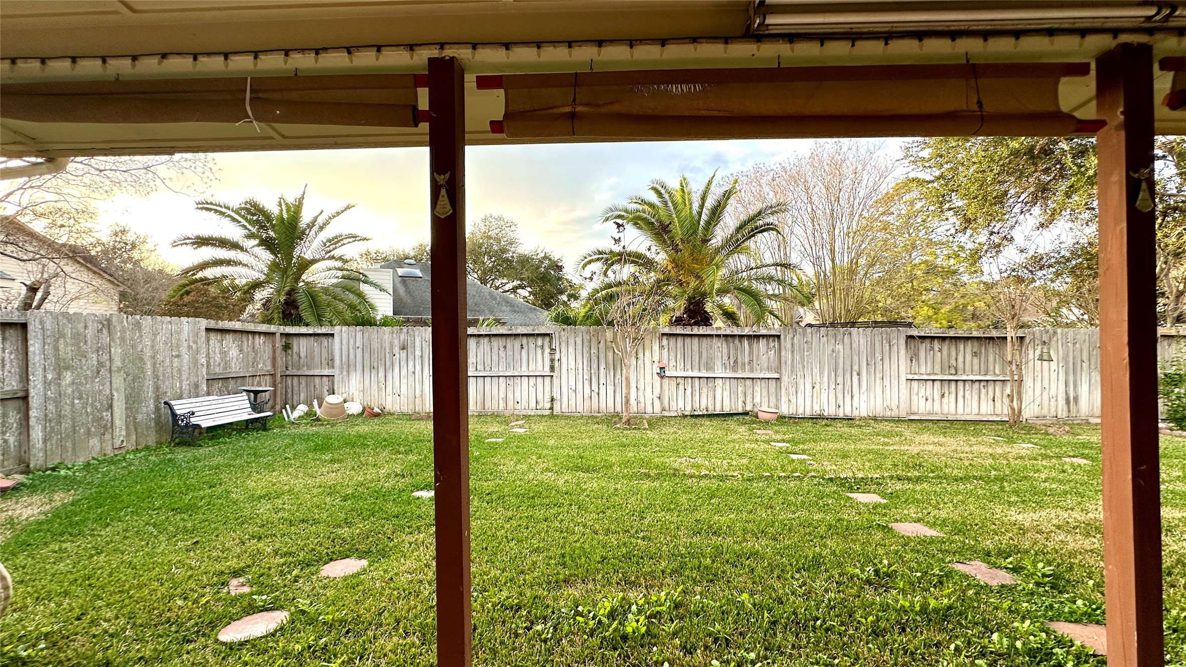 6918 Springcrest Court Sugar Land, TX 77479 - Photo 20 of 29 a view of a backyard with plants and a lake view