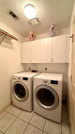 a view of a patio with a table and chairs