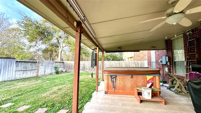 a view of swimming pool with a patio