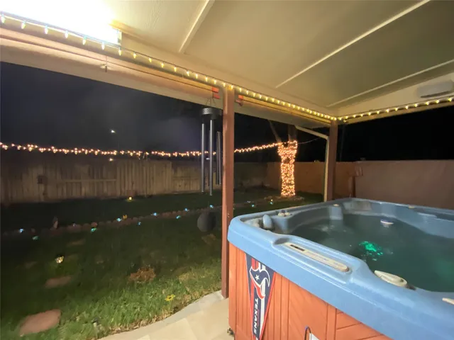 a kitchen with water heater and a sink