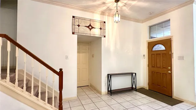 a view of an entryway with wooden floor