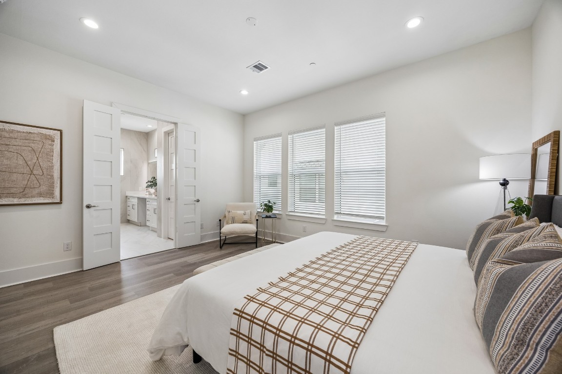 1618 Ojeman Road, Unit A Houston, TX 77055 - Photo 12 of 39 Double doors lead to the primary bedroom's ensuite bath.