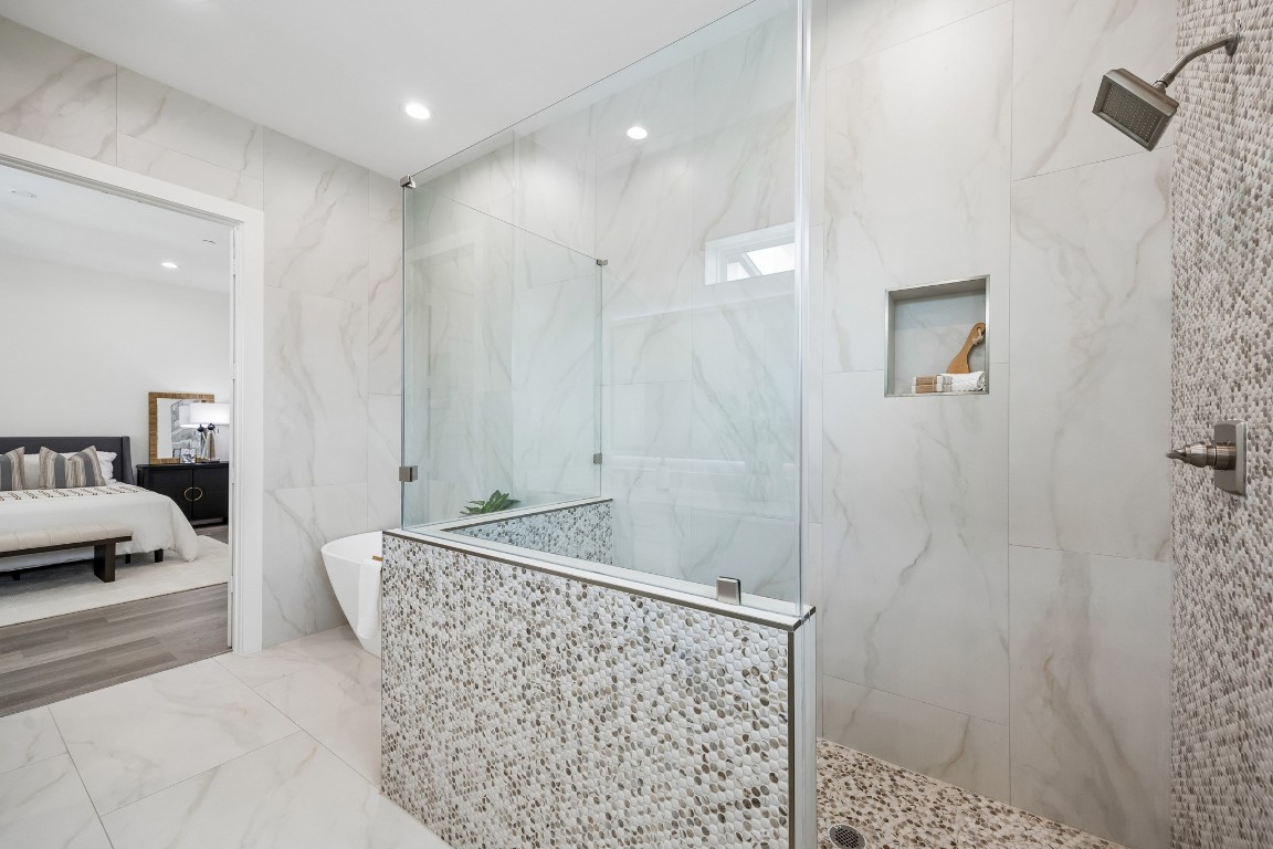 1618 Ojeman Road, Unit A Houston, TX 77055 - Photo 15 of 39 The oversized shower in the primary suite is a real indulgence.