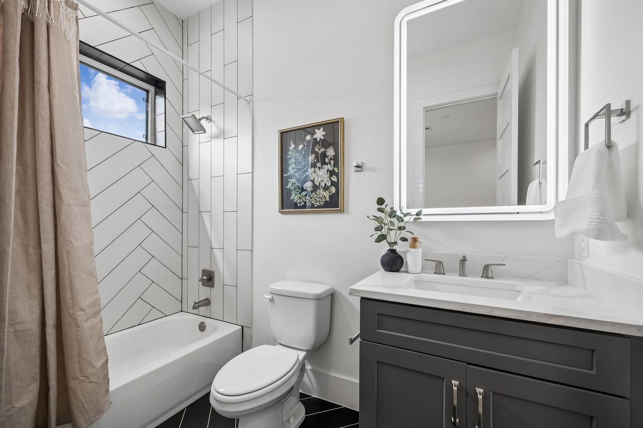 1618 Ojeman Road, Unit A Houston, TX 77055 - Photo 17 of 39 The en-suite bath has a quartz vanity and tub/shower combo.