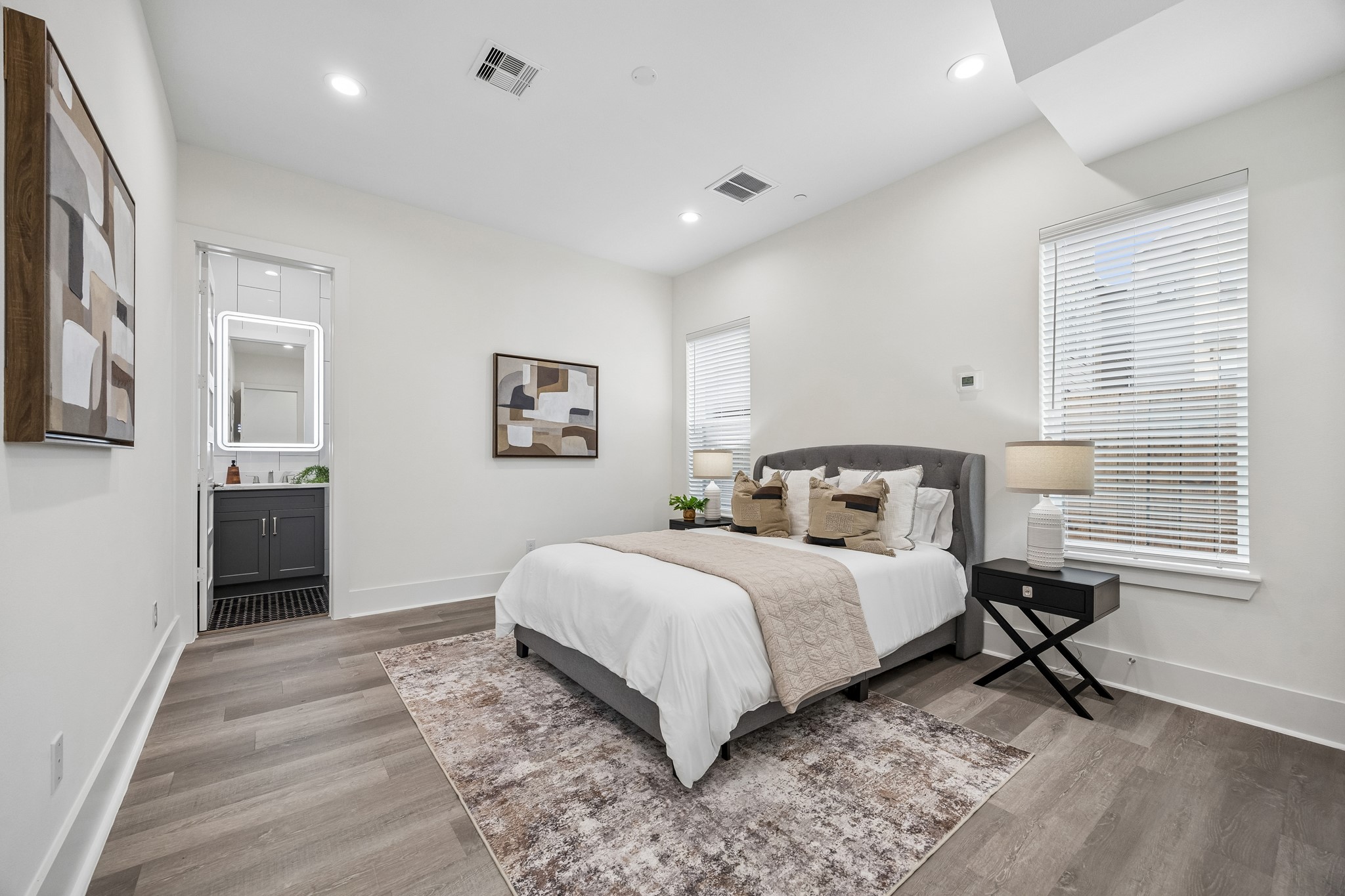 1618 Ojeman Road, Unit A Houston, TX 77055 - Photo 18 of 39 The first floor bedroom is very spacious and can even accommodate a king sized bed. It has a roomy walk in closet and a full bath with a large easily accessible shower.