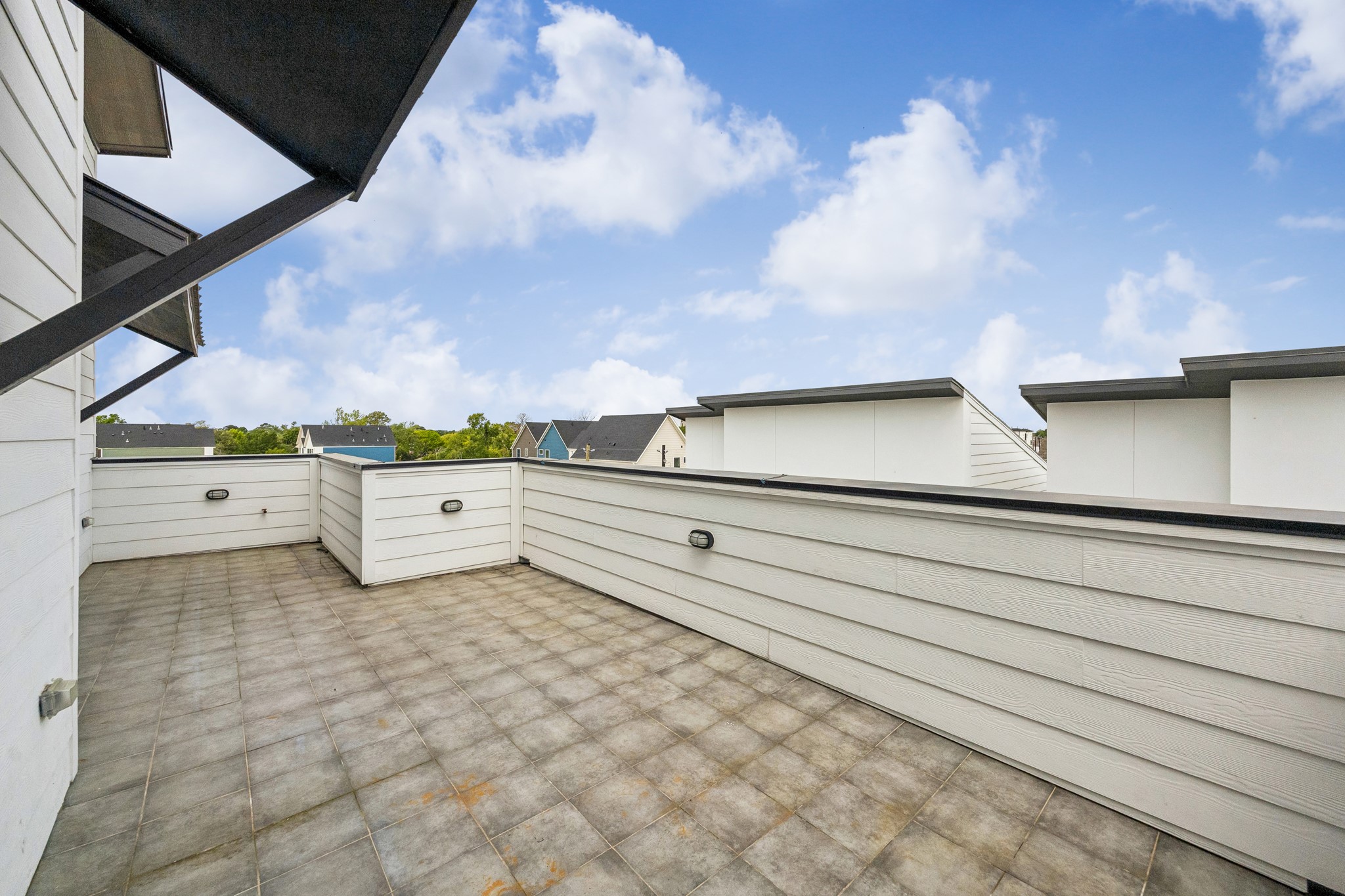 1618 Ojeman Road, Unit A Houston, TX 77055 - Photo 24 of 39 The family room opens onto the huge rooftop terrace-with plenty of room for a seating and there is a gas outlet for a grill.