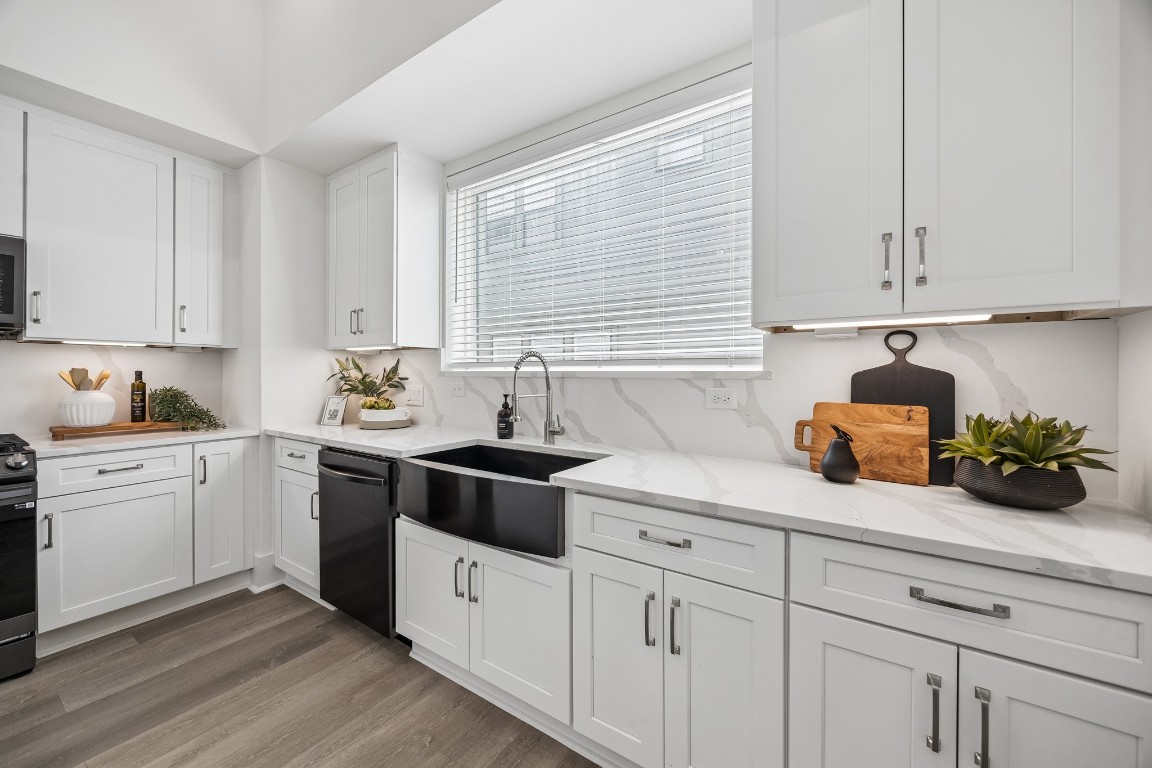 1618 Ojeman Road, Unit A Houston, TX 77055 - Photo 8 of 39 The gourmet kitchen has quartz countertops and matching backsplash.