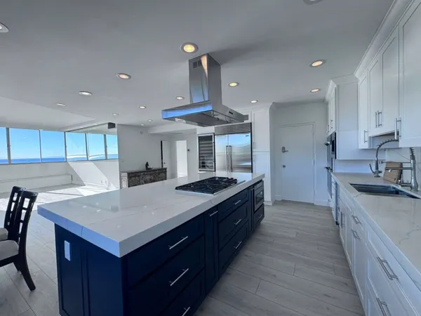 a kitchen with a stove and a sink