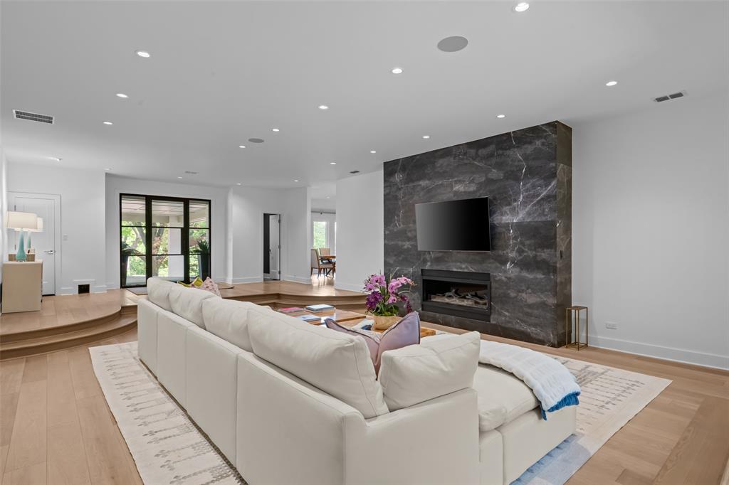 6117 Merrymount Road Westover Hills, TX 76107 - Photo 11 of 39 Living area featuring light wood-style flooring, recessed lighting, and a premium fireplace