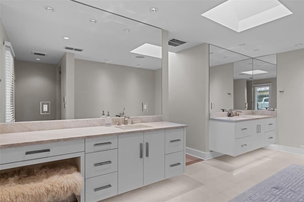 6117 Merrymount Road Westover Hills, TX 76107 - Photo 23 of 39 Full bath featuring a skylight, two vanities, light tile patterned floors, and recessed lighting