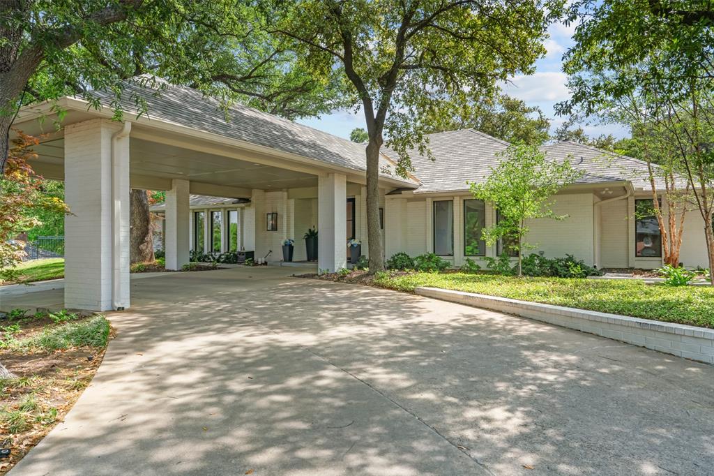 6117 Merrymount Road Westover Hills, TX 76107 - Photo 6 of 39 Ranch-style home with a carport, driveway, a shingled roof, and brick siding