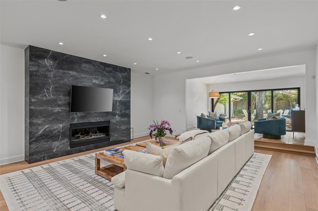 6117 Merrymount Road Westover Hills, TX 76107 - Photo 10 of 39 Living area with recessed lighting, light wood-style floors, and a high end fireplace