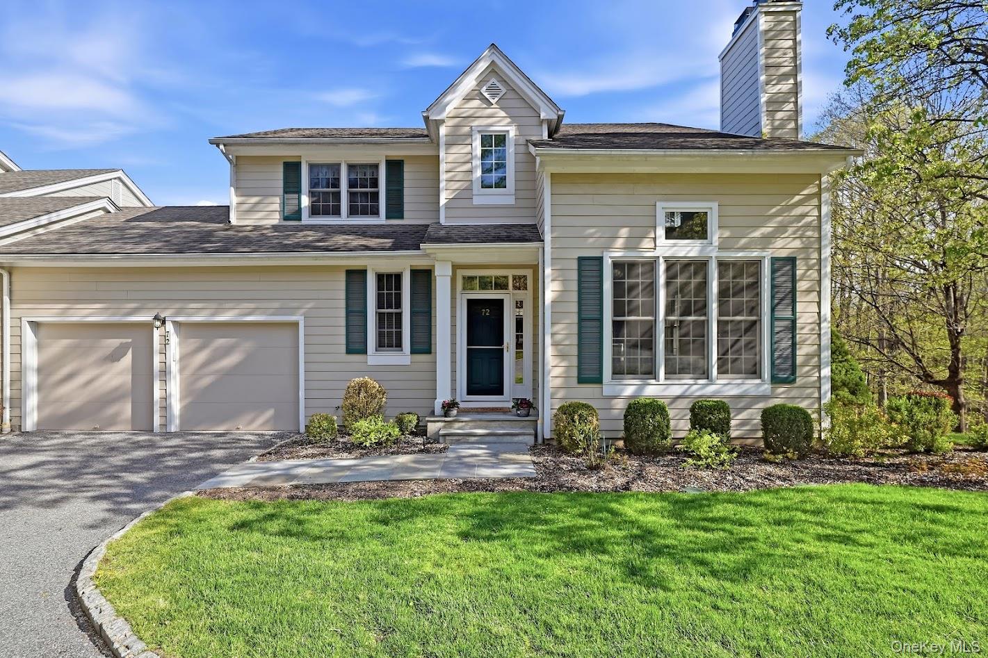 72 Burr Farms Road Mount Kisco, NY 10549 - Photo 1 of 28 a front view of a house with a garden and porch
