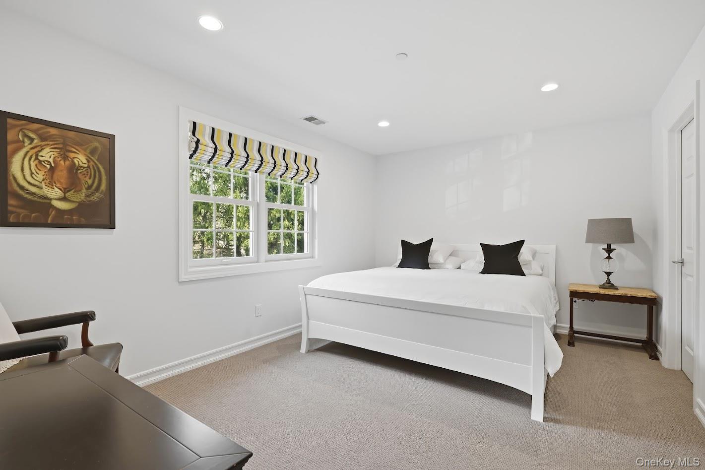 72 Burr Farms Road Mount Kisco, NY 10549 - Photo 12 of 28 a room with a bed and a window