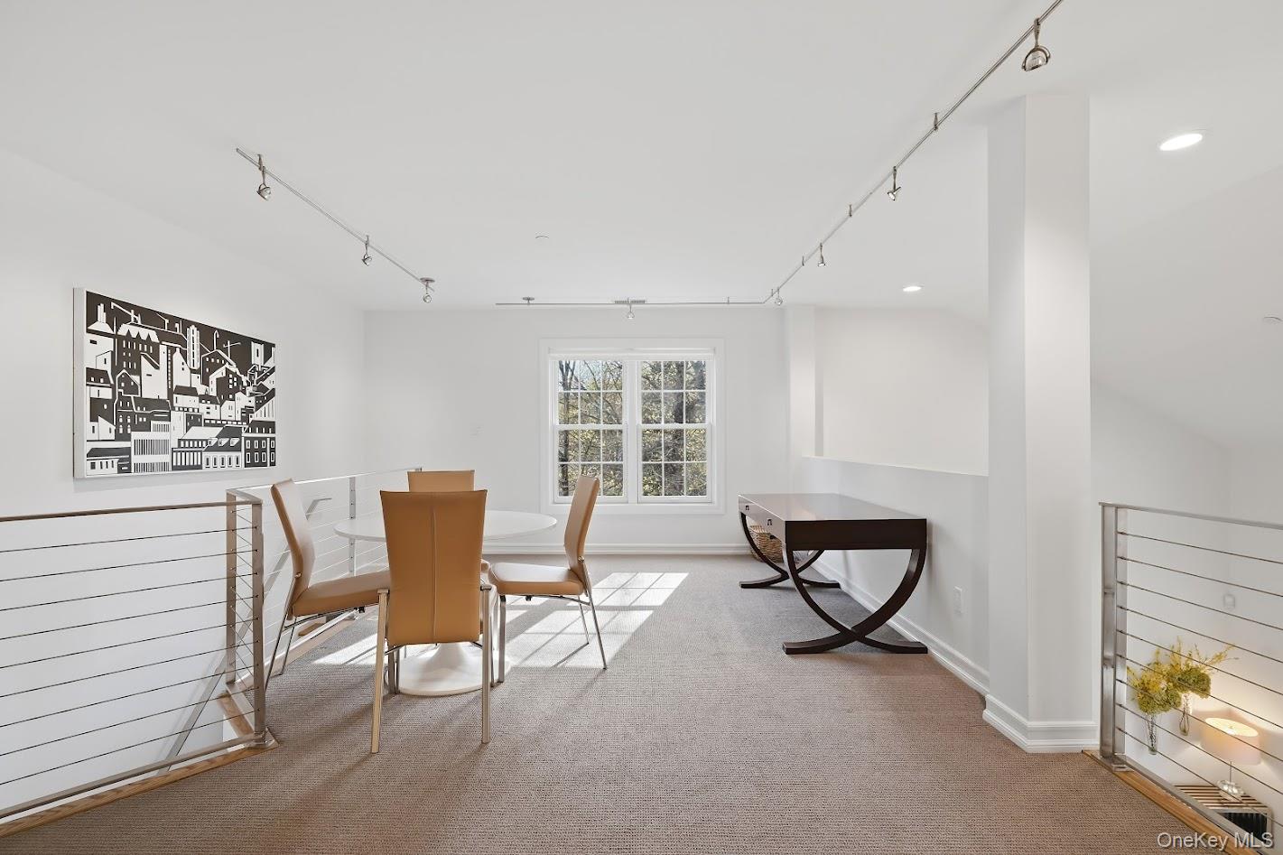 72 Burr Farms Road Mount Kisco, NY 10549 - Photo 16 of 28 a view of a workspace with furniture and a window