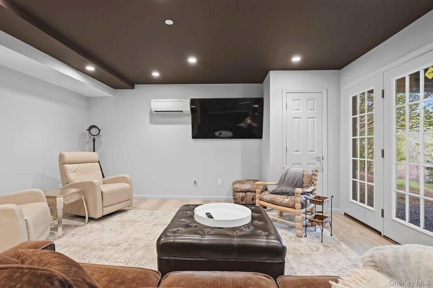 72 Burr Farms Road Mount Kisco, NY 10549 - Photo 19 of 28 a living room with furniture and a flat screen tv