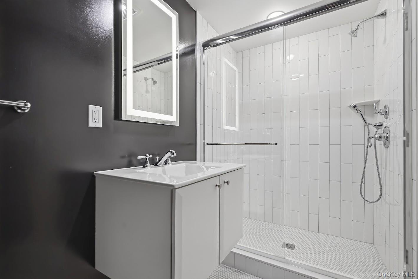 72 Burr Farms Road Mount Kisco, NY 10549 - Photo 21 of 28 a bathroom with a shower a sink and a mirror