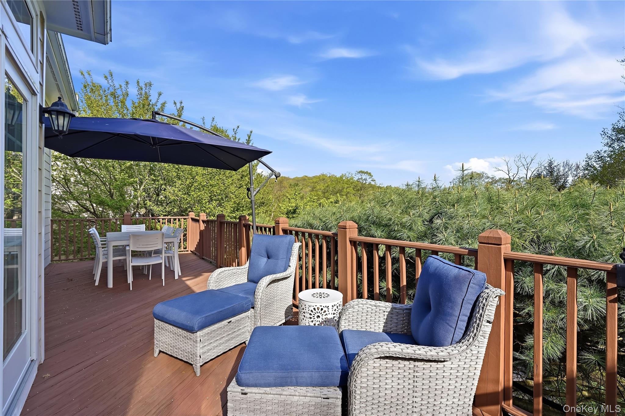72 Burr Farms Road Mount Kisco, NY 10549 - Photo 22 of 28 a view of a patio with a table chairs and a table
