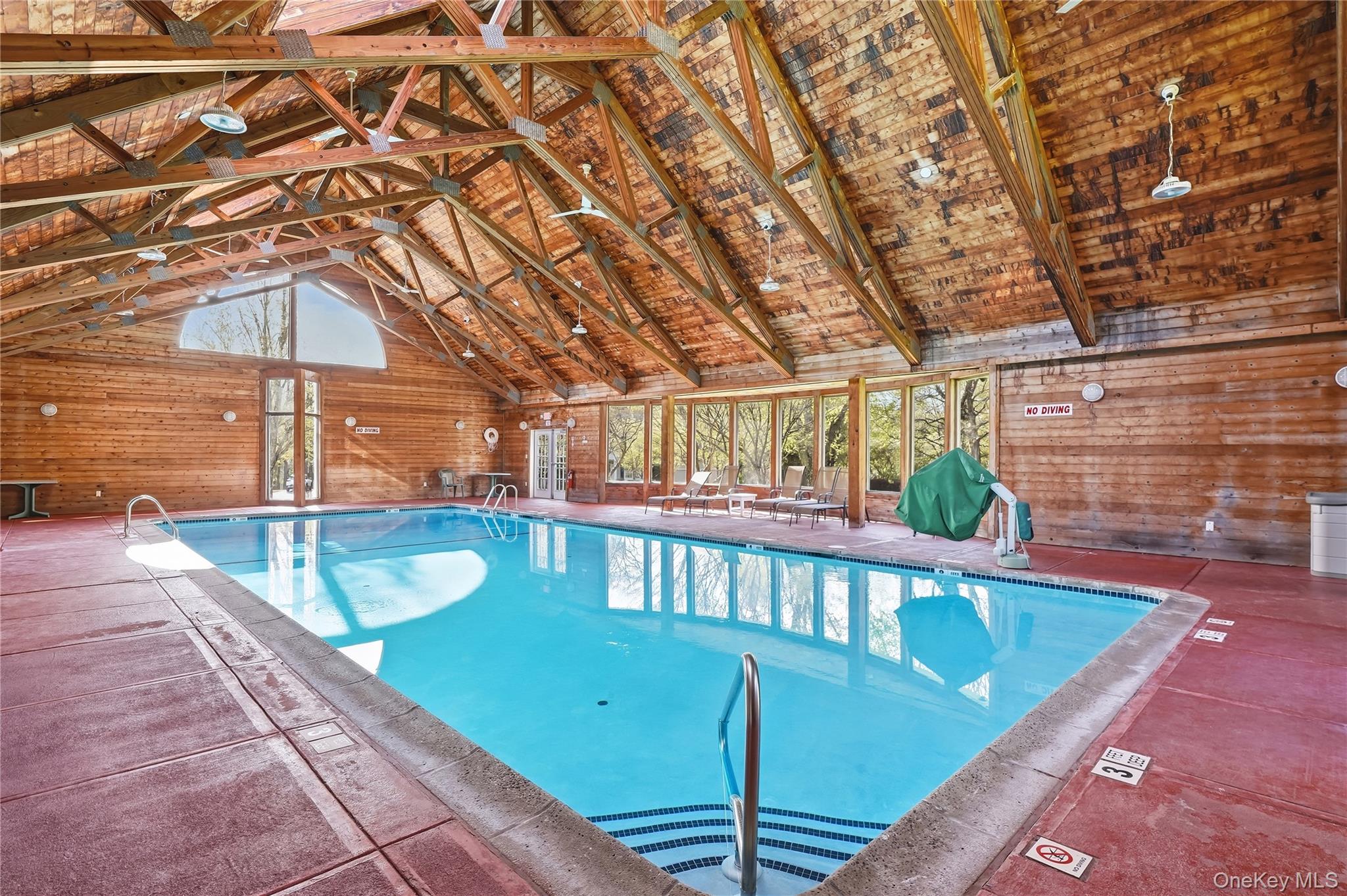 72 Burr Farms Road Mount Kisco, NY 10549 - Photo 26 of 28 a view of a swimming pool with a patio and a yard