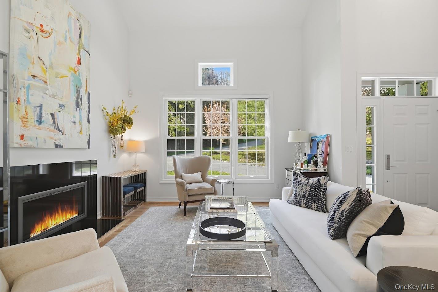 72 Burr Farms Road Mount Kisco, NY 10549 - Photo 4 of 28 a living room with furniture and a fireplace