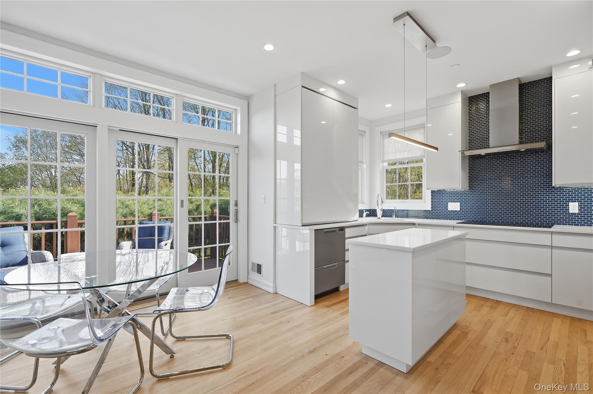 72 Burr Farms Road Mount Kisco, NY 10549 - Photo 5 of 28 a kitchen with stainless steel appliances granite countertop a stove and a wooden floors