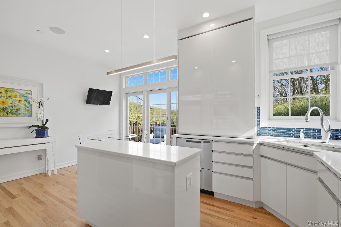 72 Burr Farms Road Mount Kisco, NY 10549 - Photo 6 of 28 a large kitchen with kitchen island a sink stainless steel appliances and cabinets