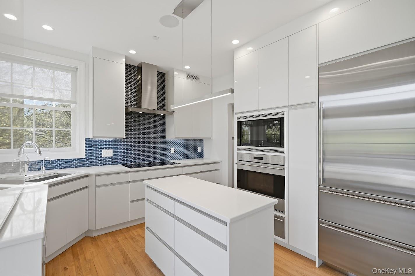 72 Burr Farms Road Mount Kisco, NY 10549 - Photo 7 of 28 a kitchen with a sink stainless steel appliances and cabinets