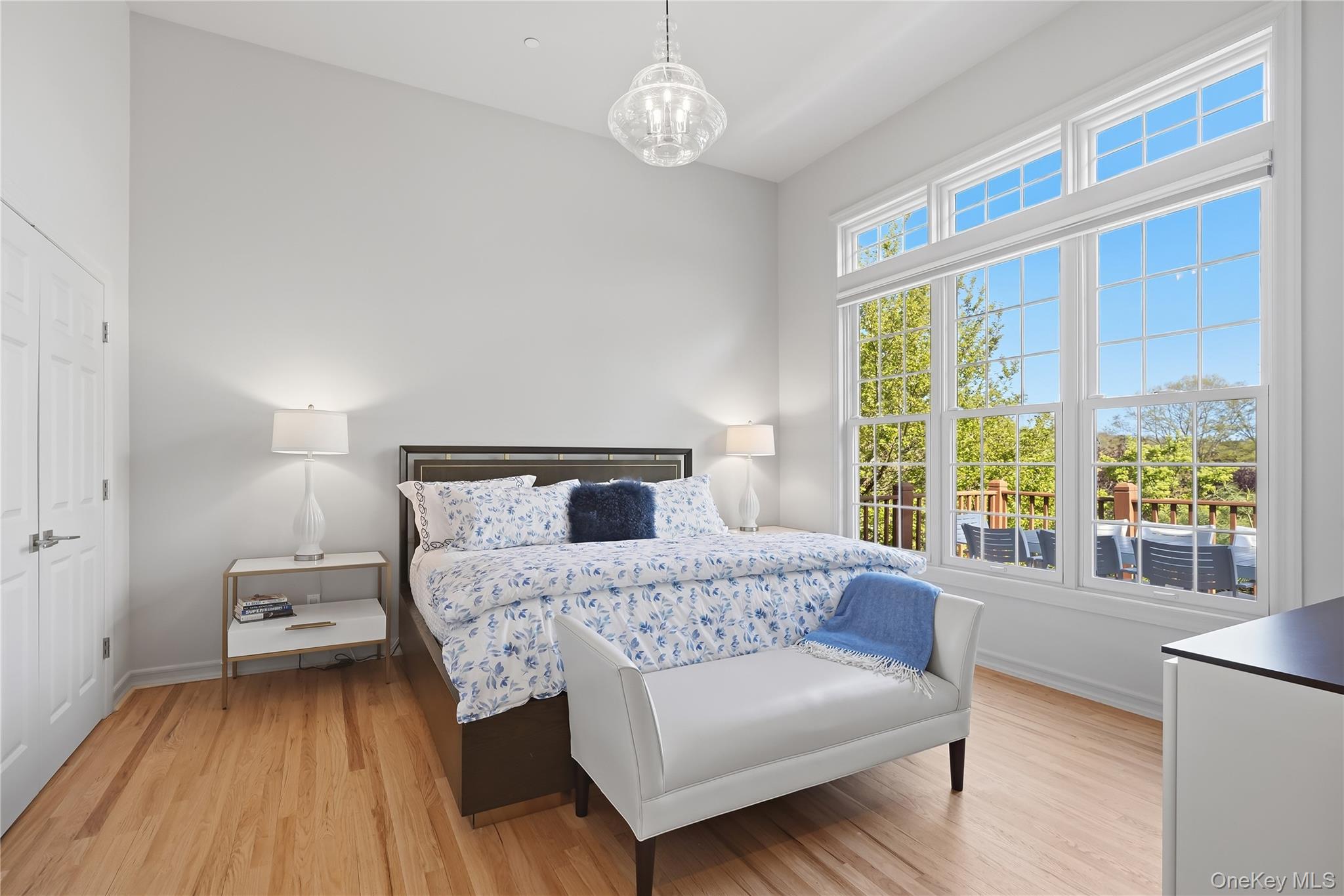72 Burr Farms Road Mount Kisco, NY 10549 - Photo 8 of 28 a bedroom with a bed and a large window with outer view