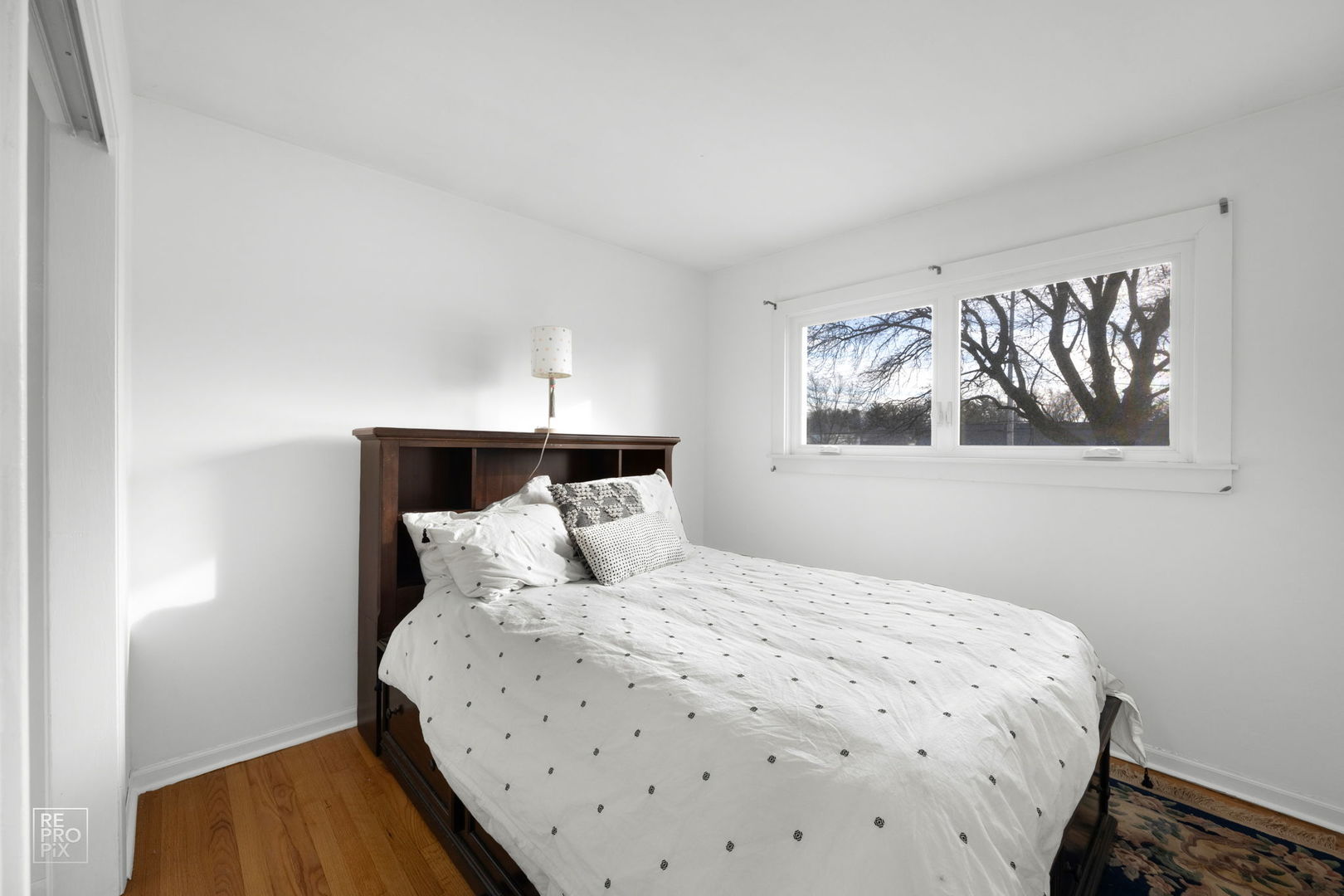 362 63rd Street Willowbrook, IL 60527 - Photo 20 of 25 a bedroom with a bed and wooden floor