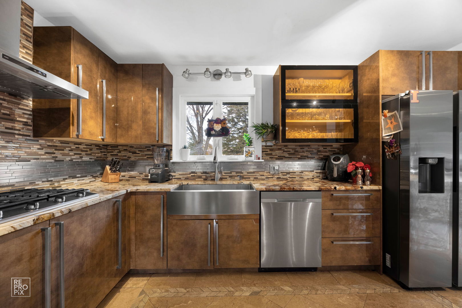 362 63rd Street Willowbrook, IL 60527 - Photo 6 of 25 a kitchen with stainless steel appliances granite countertop a stove a sink and a microwave