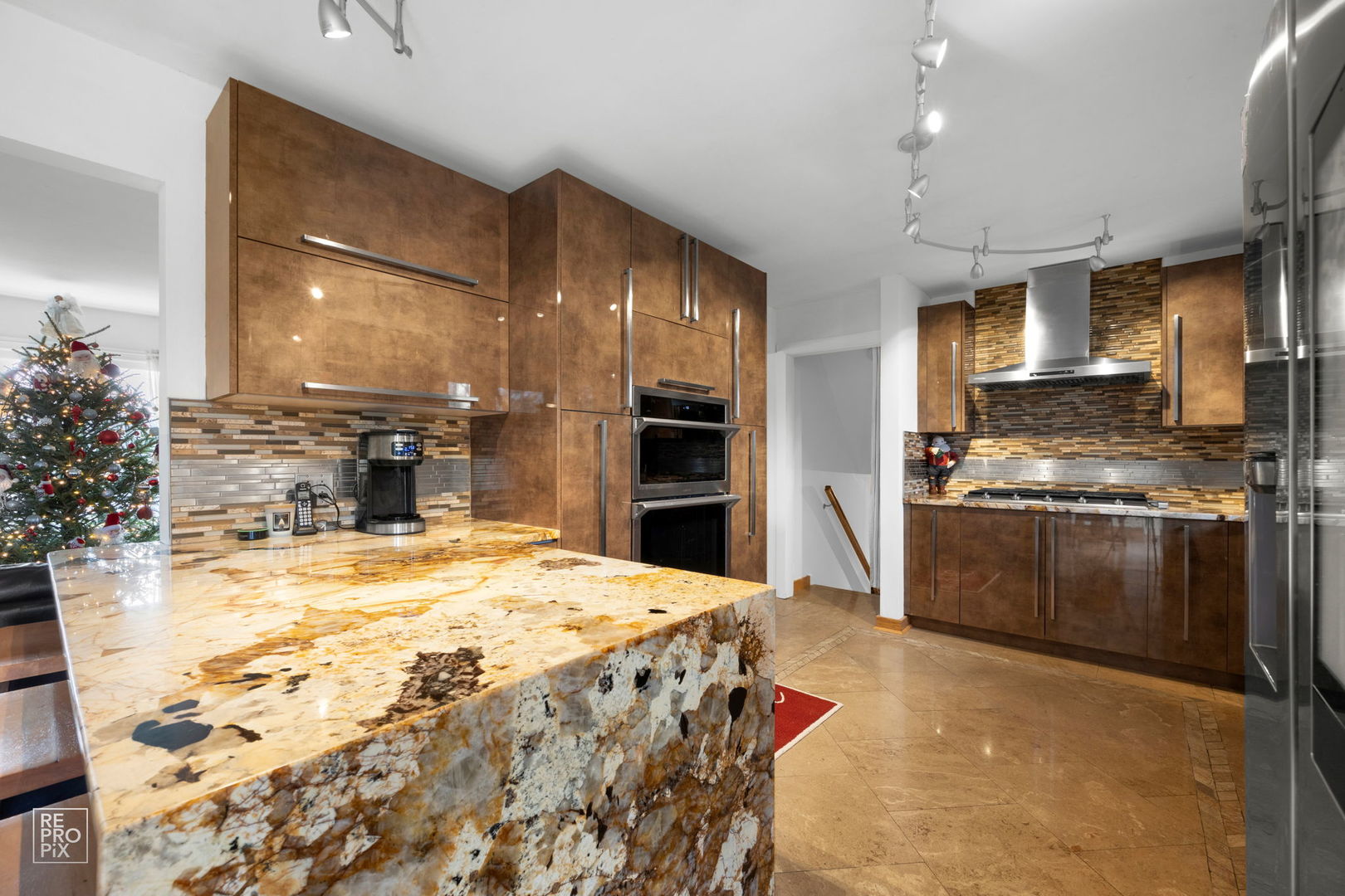 362 63rd Street Willowbrook, IL 60527 - Photo 8 of 25 a kitchen with stainless steel appliances kitchen island granite countertop a stove and a refrigerator