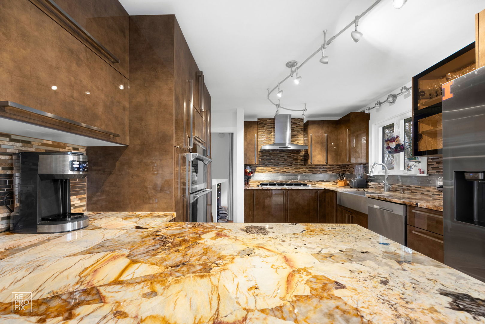 362 63rd Street Willowbrook, IL 60527 - Photo 10 of 25 a large kitchen with stainless steel appliances kitchen island granite countertop a refrigerator and a sink