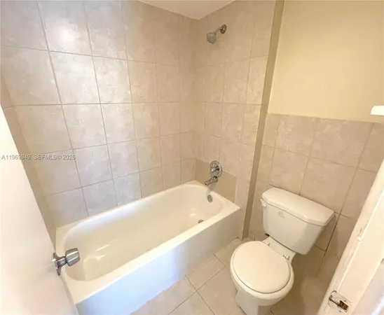 a bathroom with a sink a toilet and bathtub