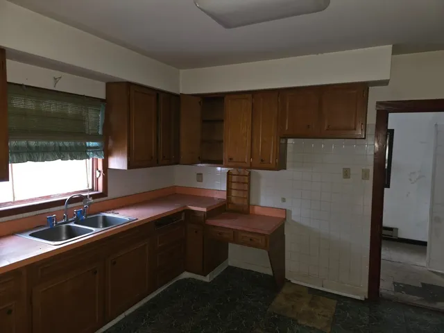 a view of a hallway with windows