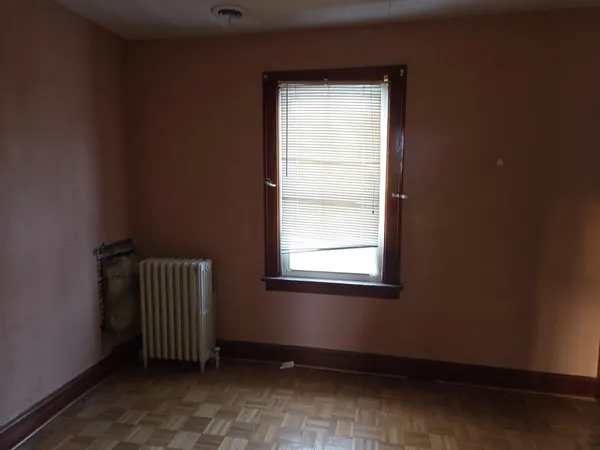 a bathroom with a bathtub and a window