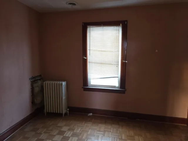 a bathroom with a bathtub and a window