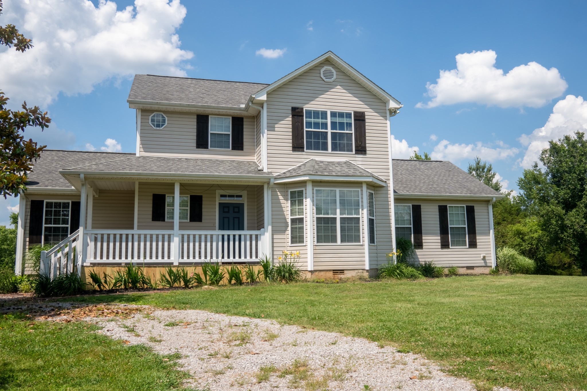 4360 Hardison Mill Road Columbia, TN 38401 - Photo 3 of 22 a front view of a house with a garden
