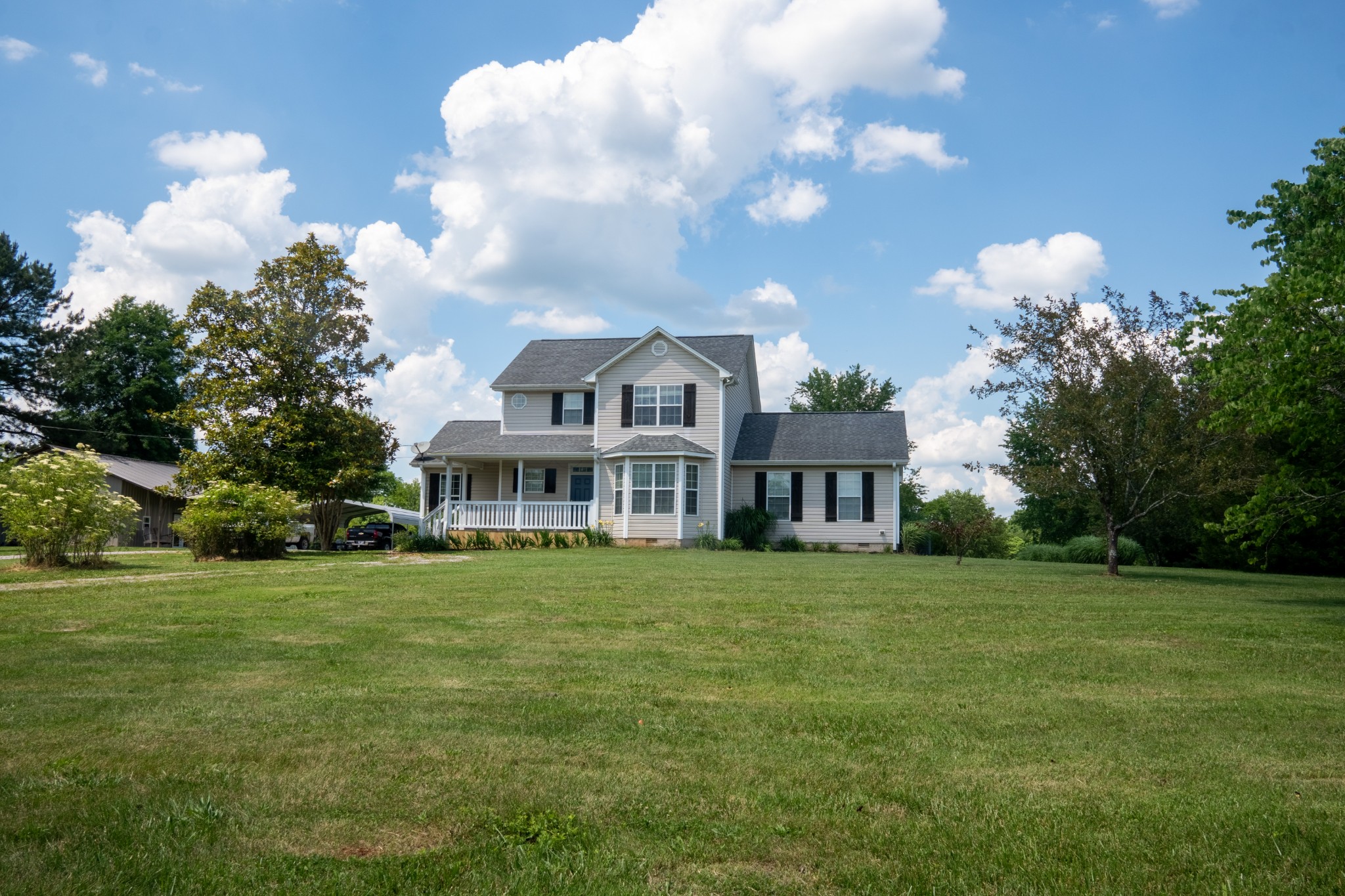 4360 Hardison Mill Road Columbia, TN 38401 - Photo 4 of 22 a front view of a house with garden