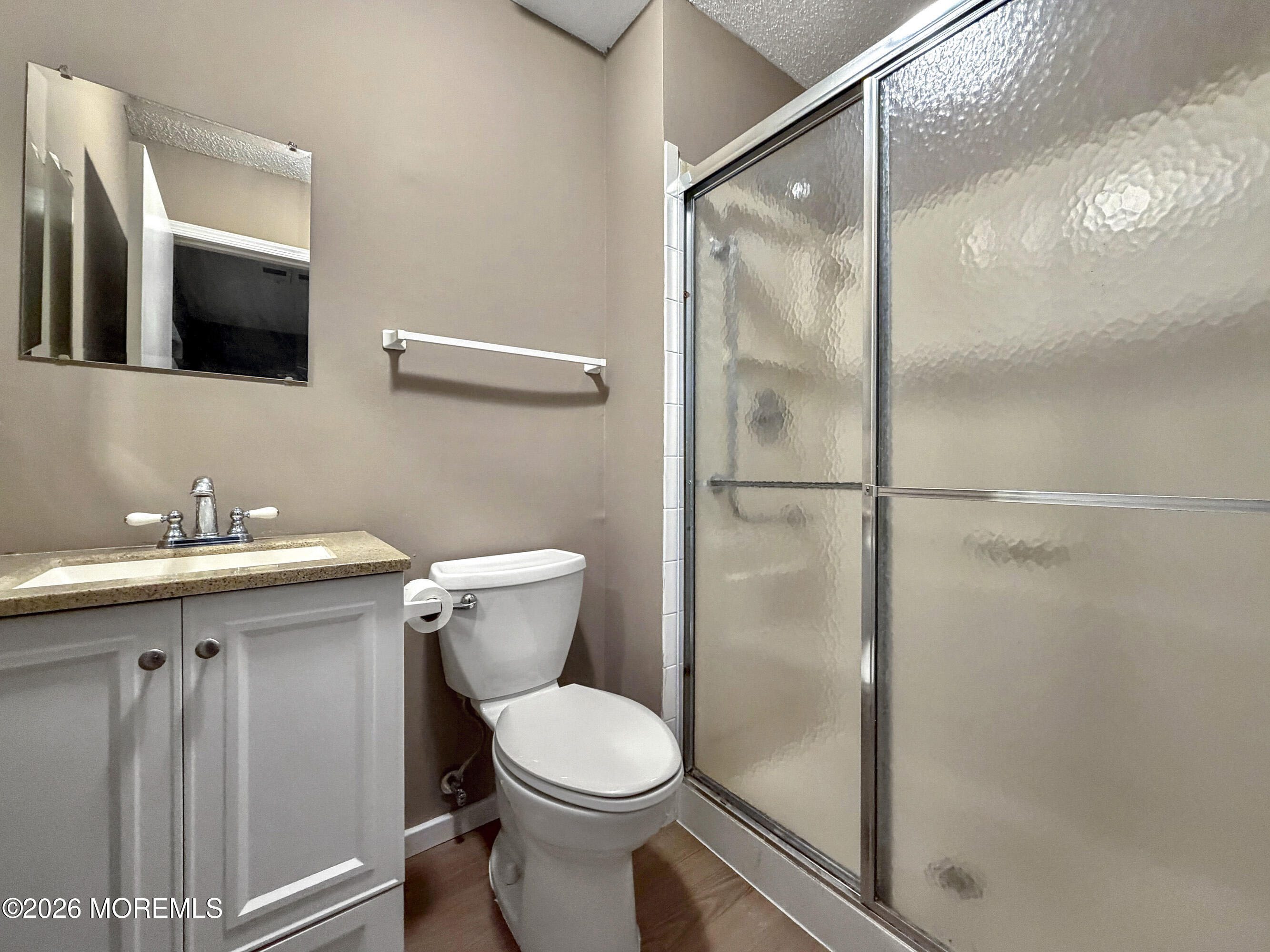 47 Carnaby Close Freehold, NJ 07728 - Photo 18 of 29 a bathroom with a toilet sink and mirror