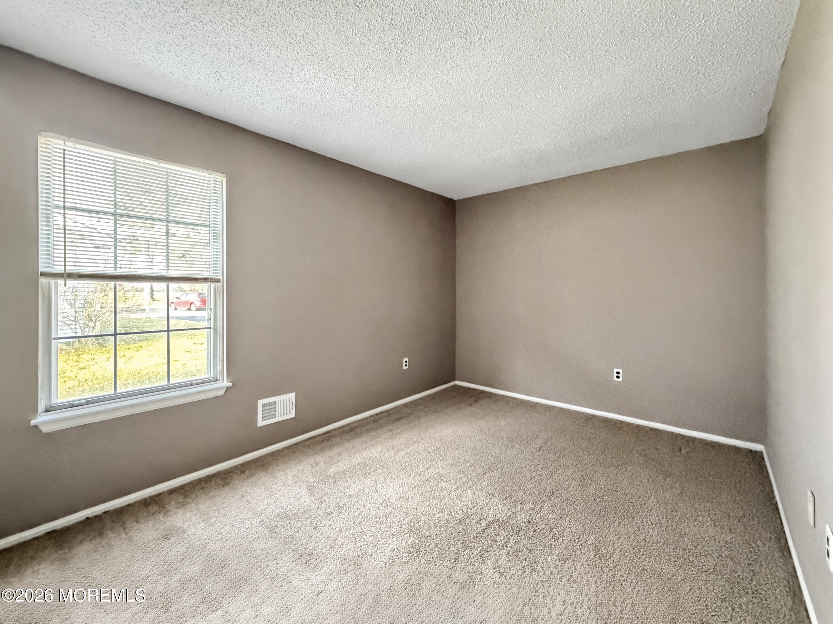 47 Carnaby Close Freehold, NJ 07728 - Photo 19 of 29 an empty room with a window