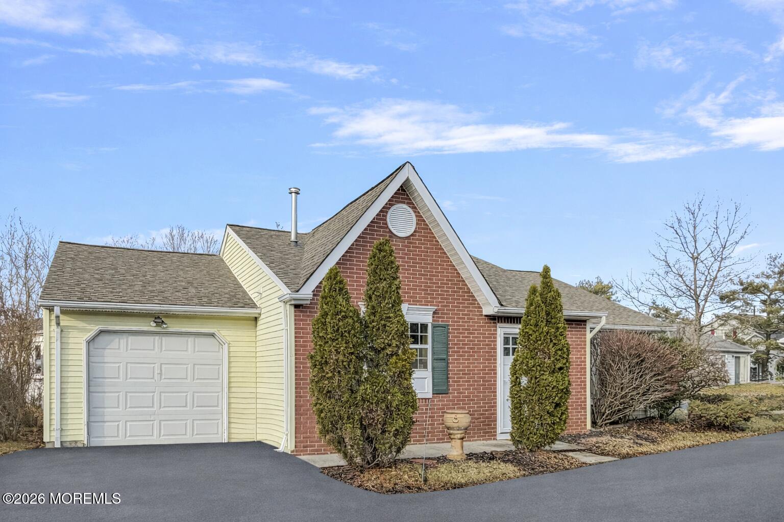 47 Carnaby Close Freehold, NJ 07728 - Photo 2 of 29 a front view of a house with a yard and garage