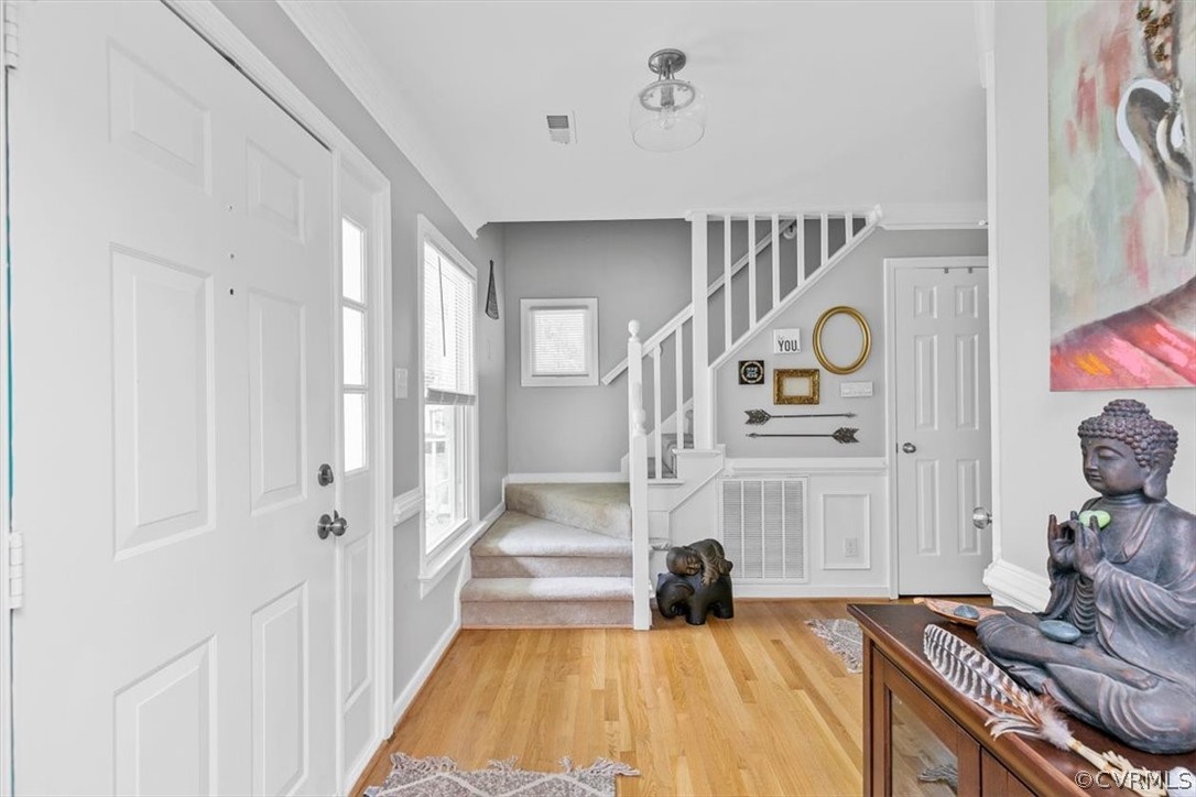 5705 Ridge Point Court Midlothian, VA 23112 - Photo 5 of 46 a spacious bedroom with a bed and a chandelier