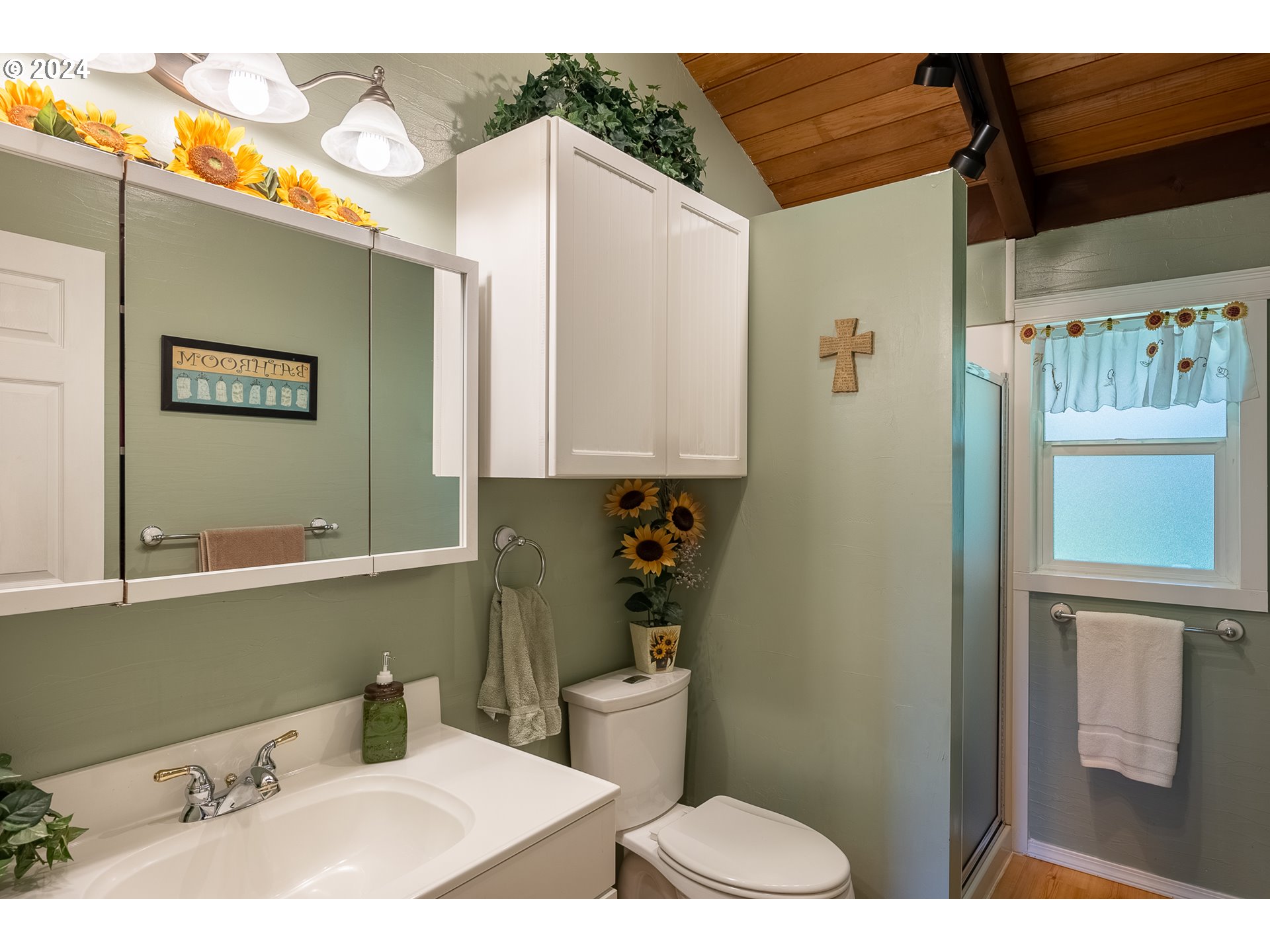 89915 Ben Bunch Road Florence, OR 97439 - Photo 14 of 33 a bathroom with a toilet sink and mirror
