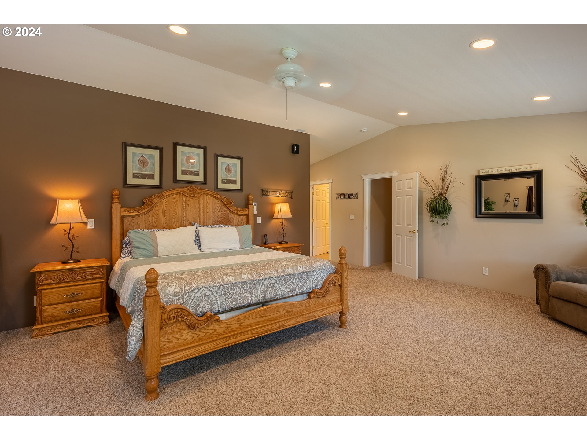 89915 Ben Bunch Road Florence, OR 97439 - Photo 16 of 33 a bedroom with a bed and a lamp