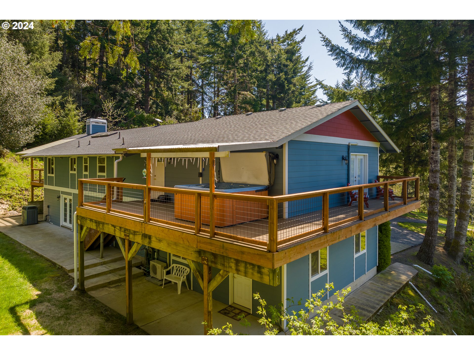 89915 Ben Bunch Road Florence, OR 97439 - Photo 22 of 33 a view of a house with backyard porch and sitting area