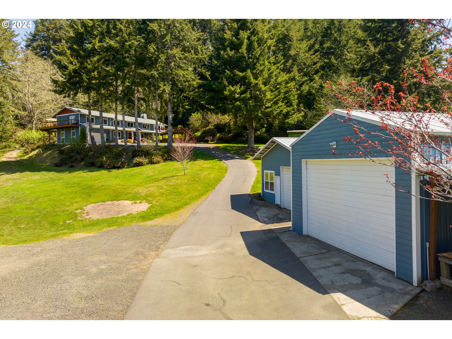89915 Ben Bunch Road Florence, OR 97439 - Photo 23 of 33 a view of swimming pool with lawn chairs and plants